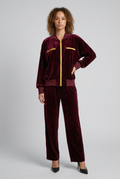 Front view of the slim model in the burgundy velour suit