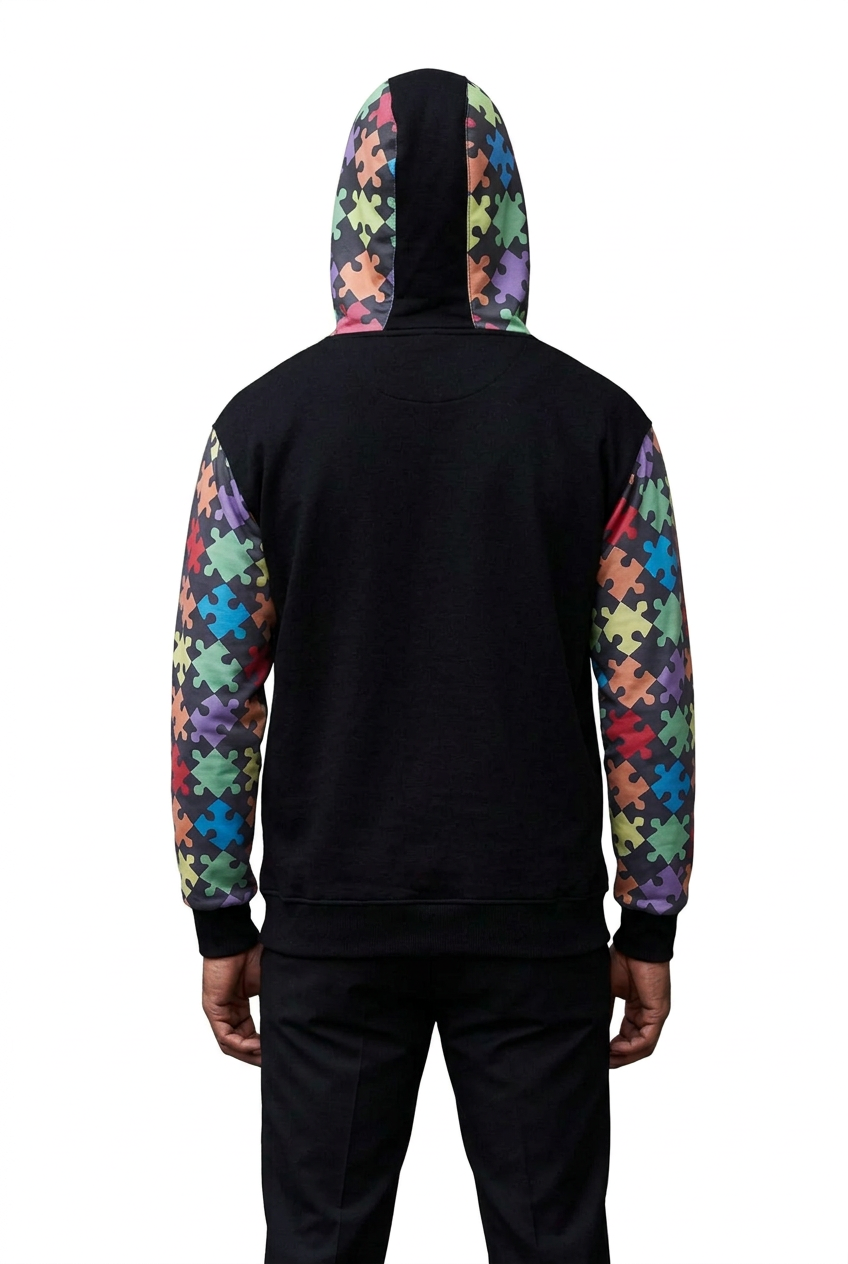 Male model showing the back of the black Dborra puzzle hoodie on white